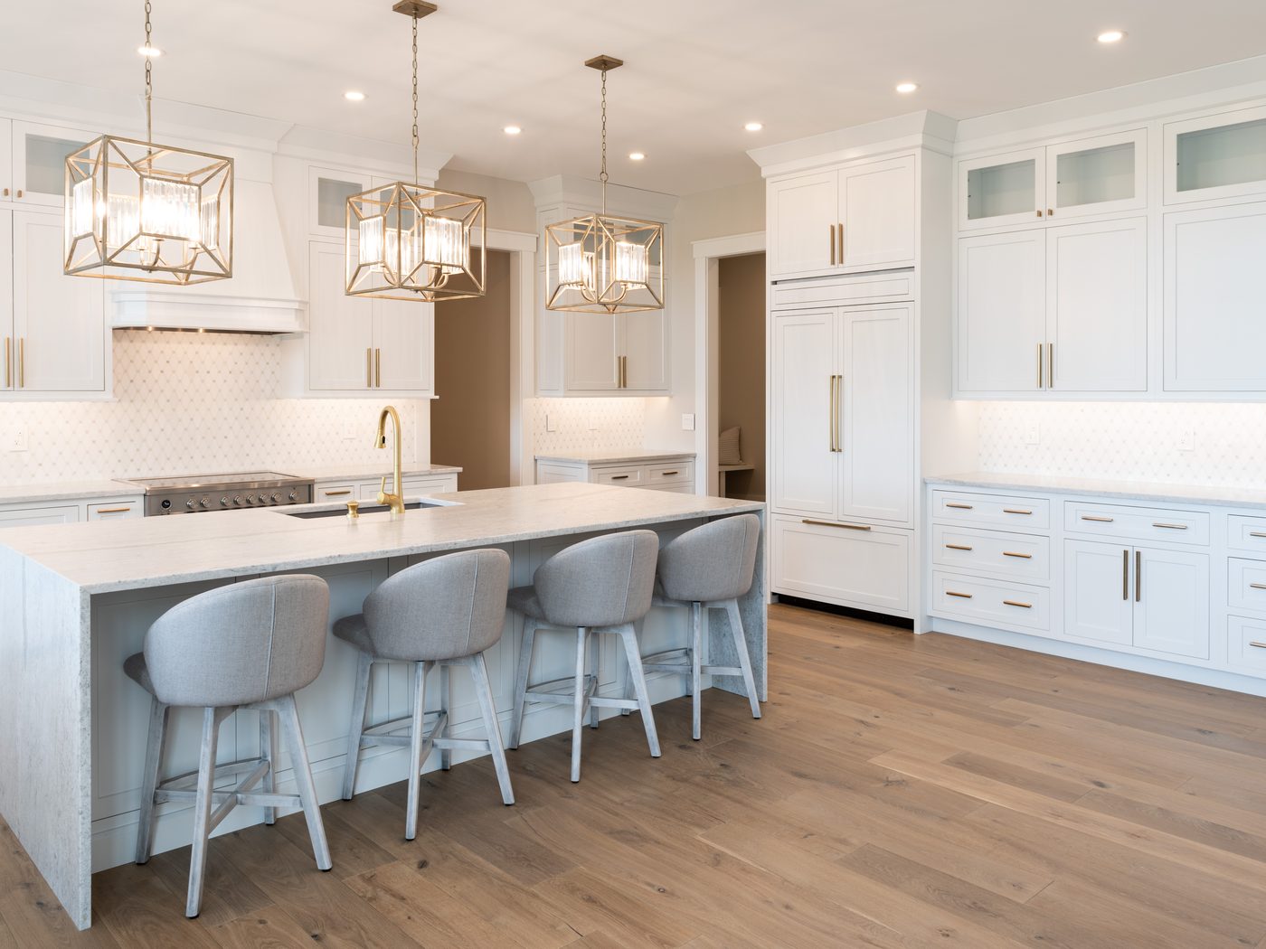 White flush inset kitchen with glass display uppers and brass pendants — Candlelight Road, Rindge NH