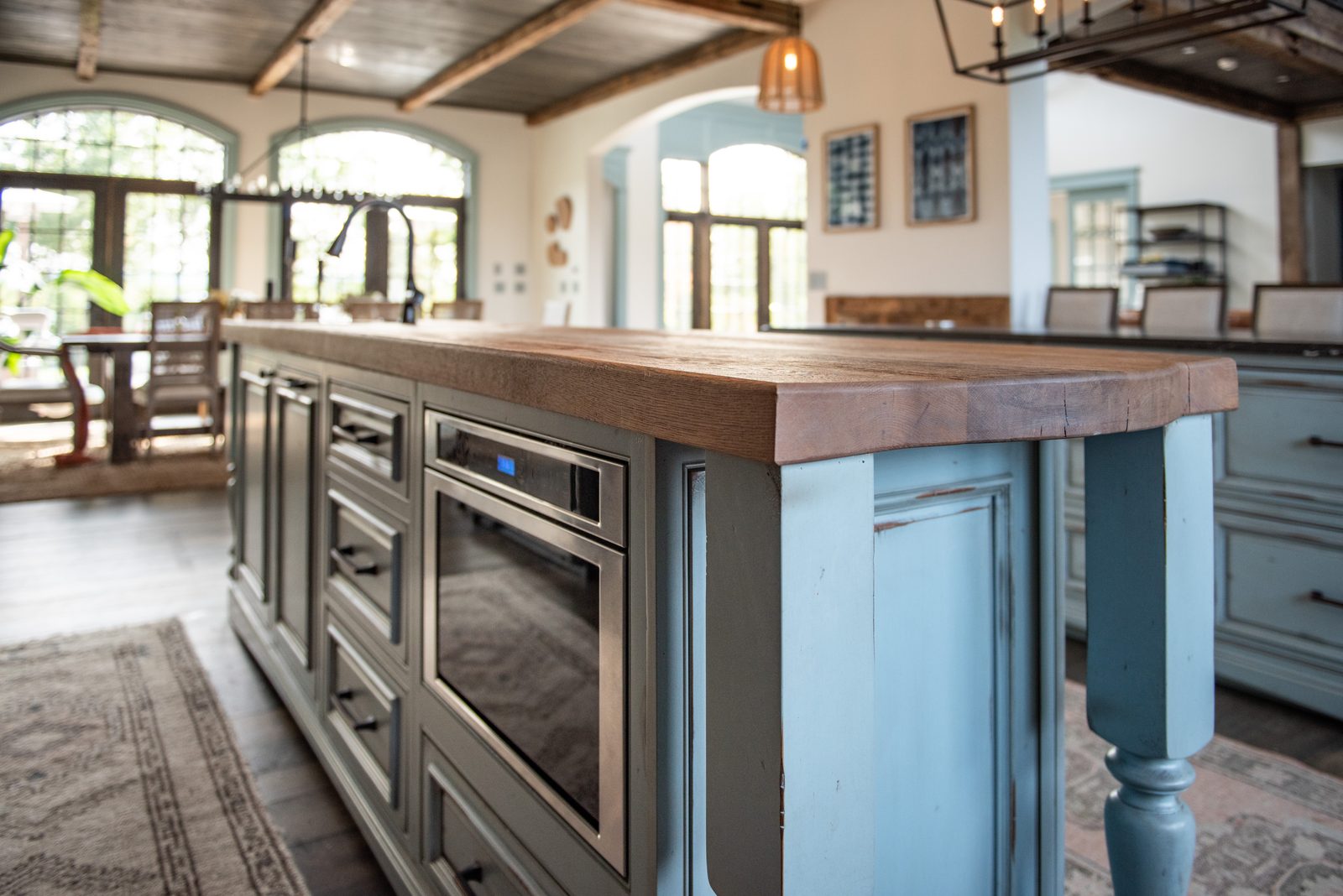 Colonial Blue island with reclaimed-wood top and timber beams