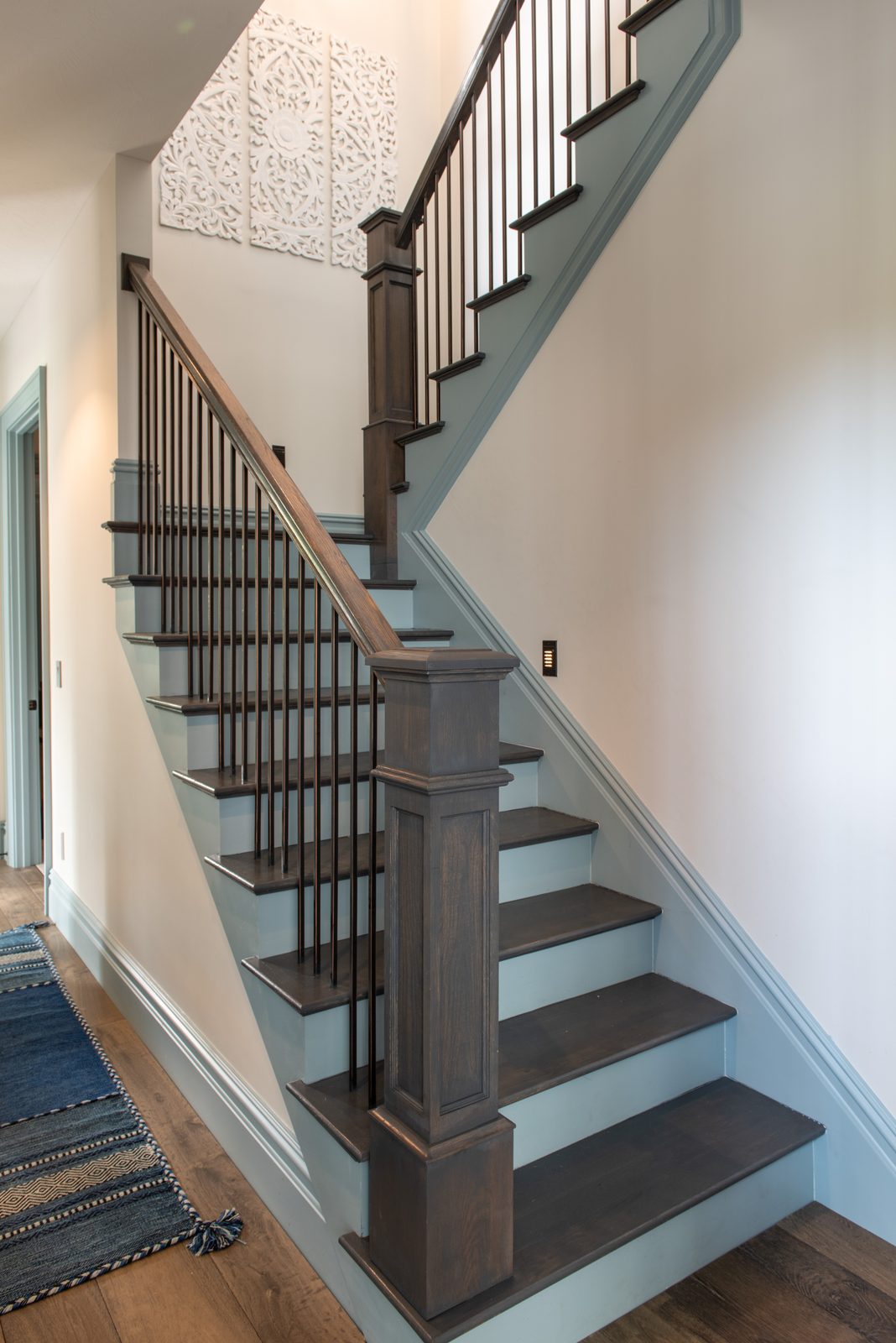 Staircase with painted risers and wood treads
