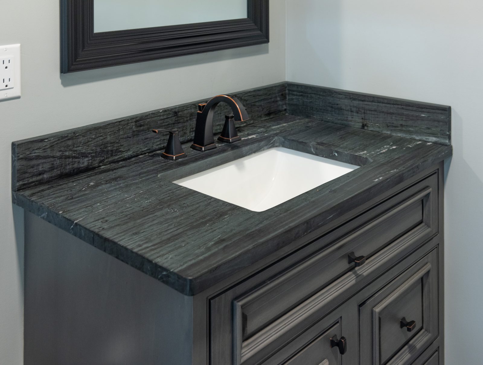Bathroom vanity with dark stone top