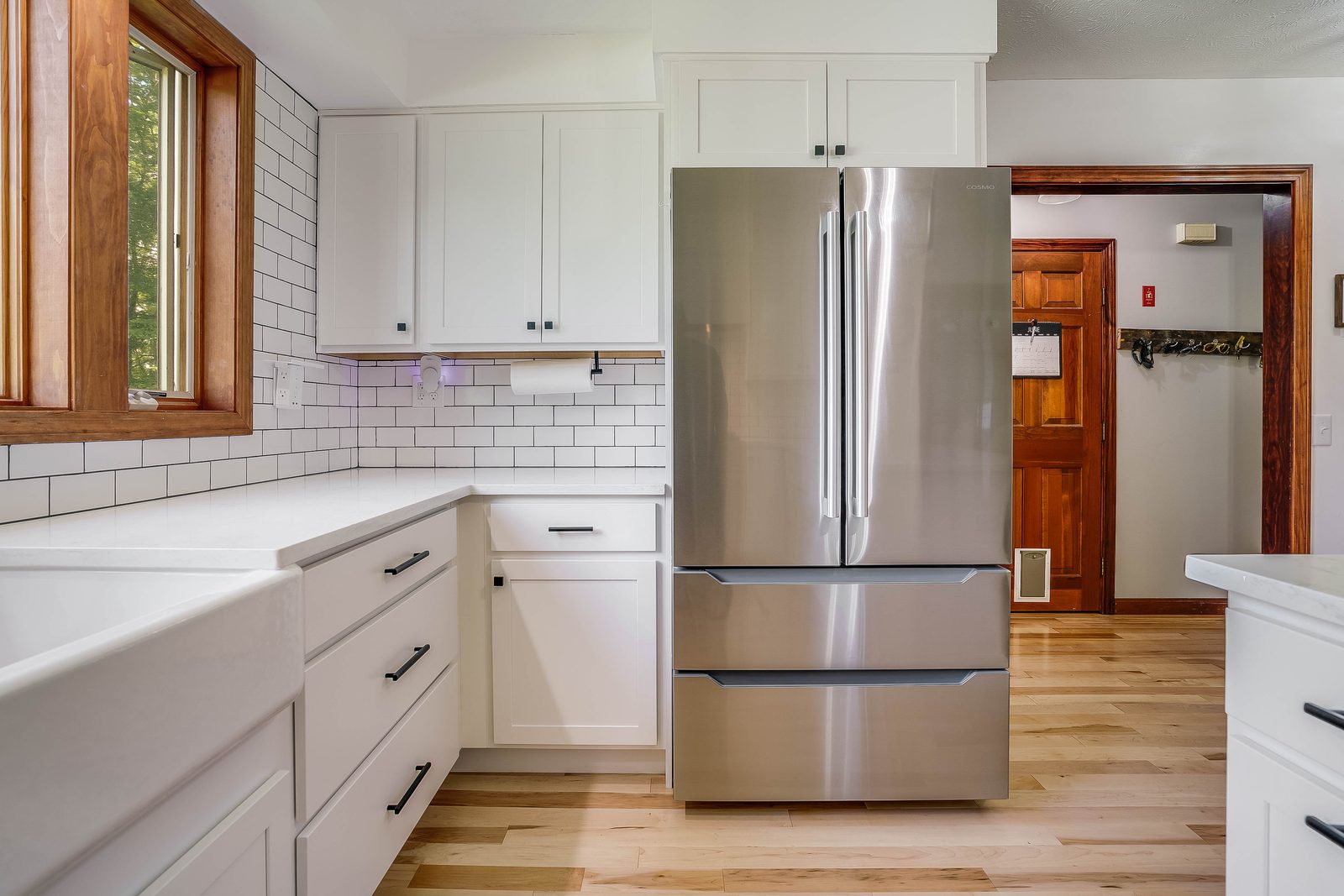 Refrigerator run and peninsula in painted white Diamond Vibe