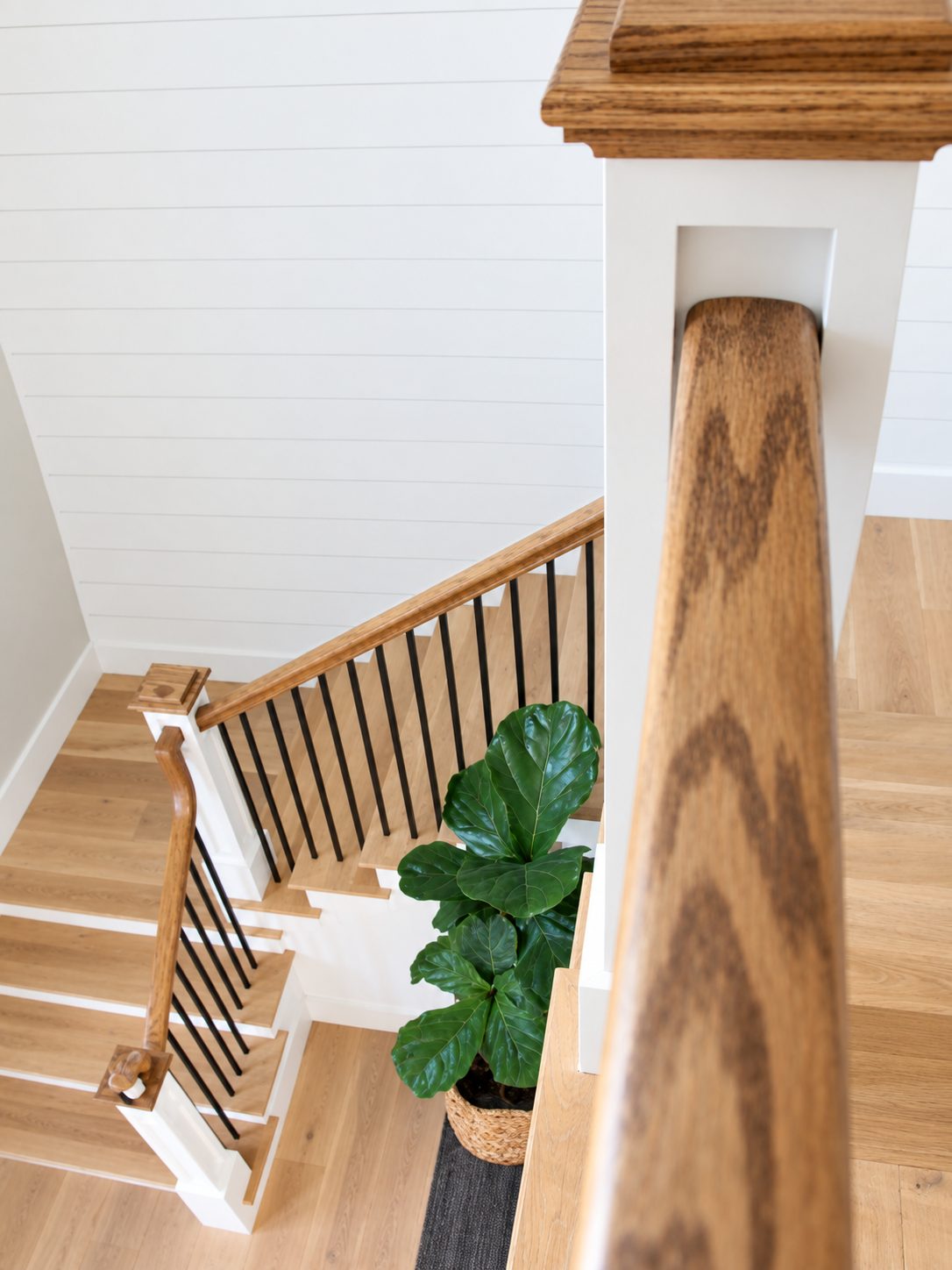 Oak newel post detail from the landing