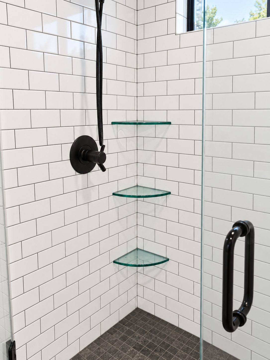Subway tile shower with glass corner shelves
