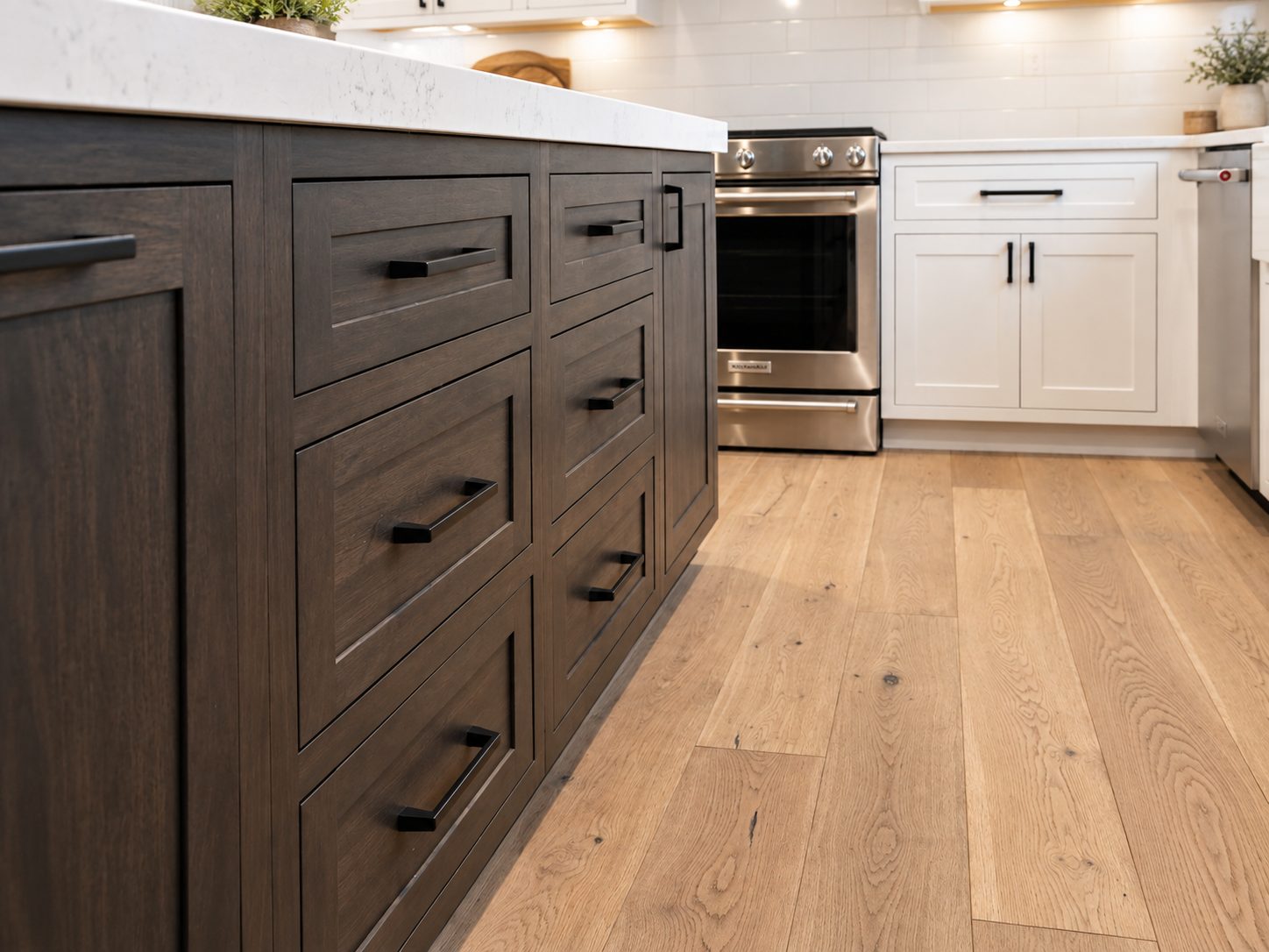 Dark stained island drawers with black pulls