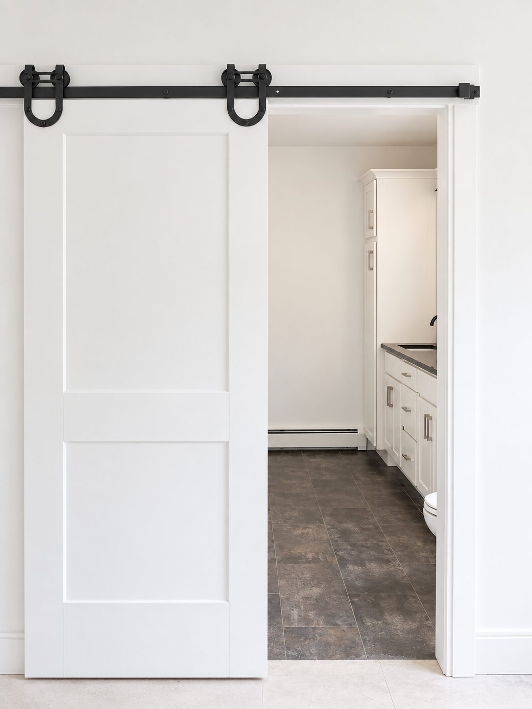 White barn door on black track