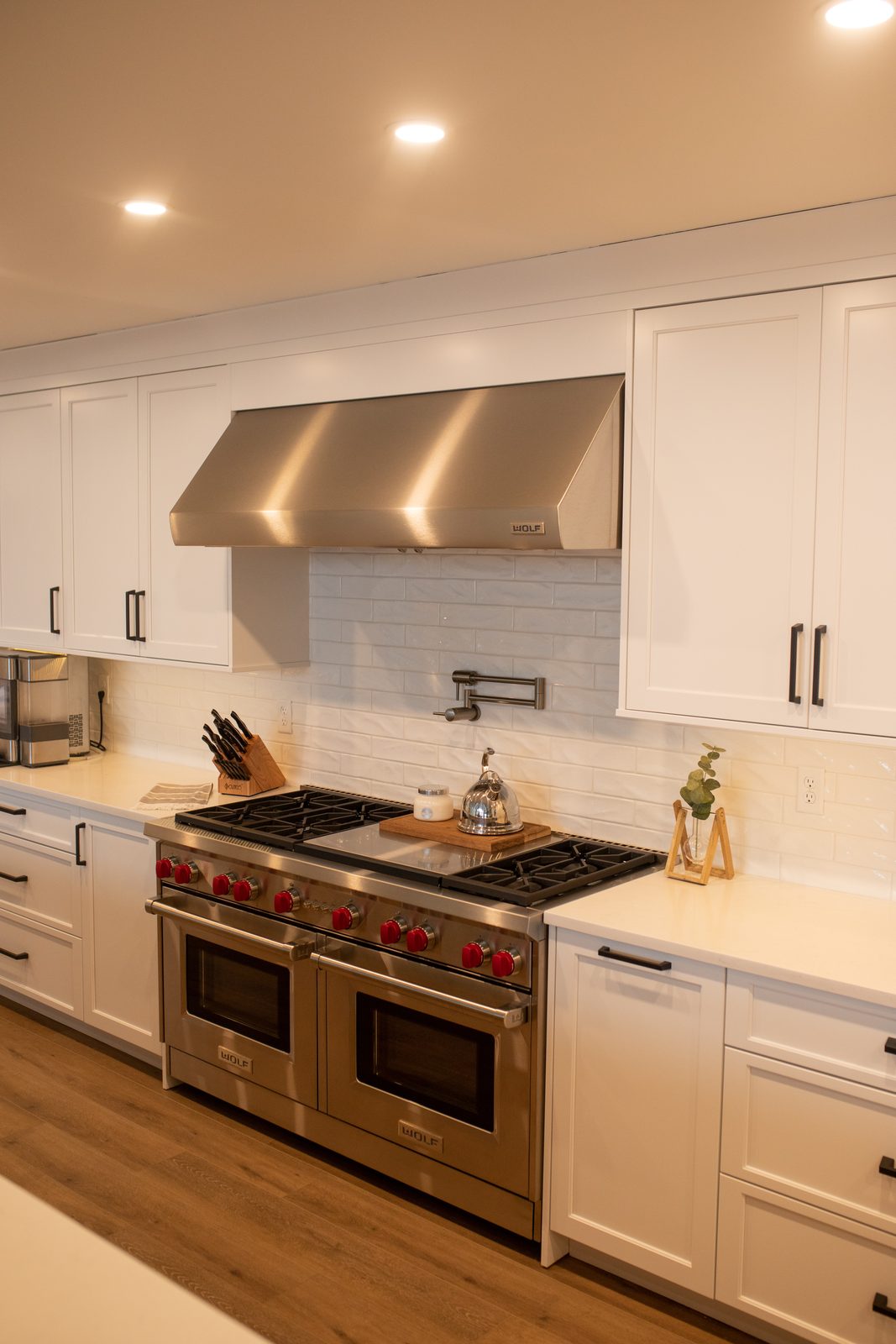 Range wall with stainless hood and white tile