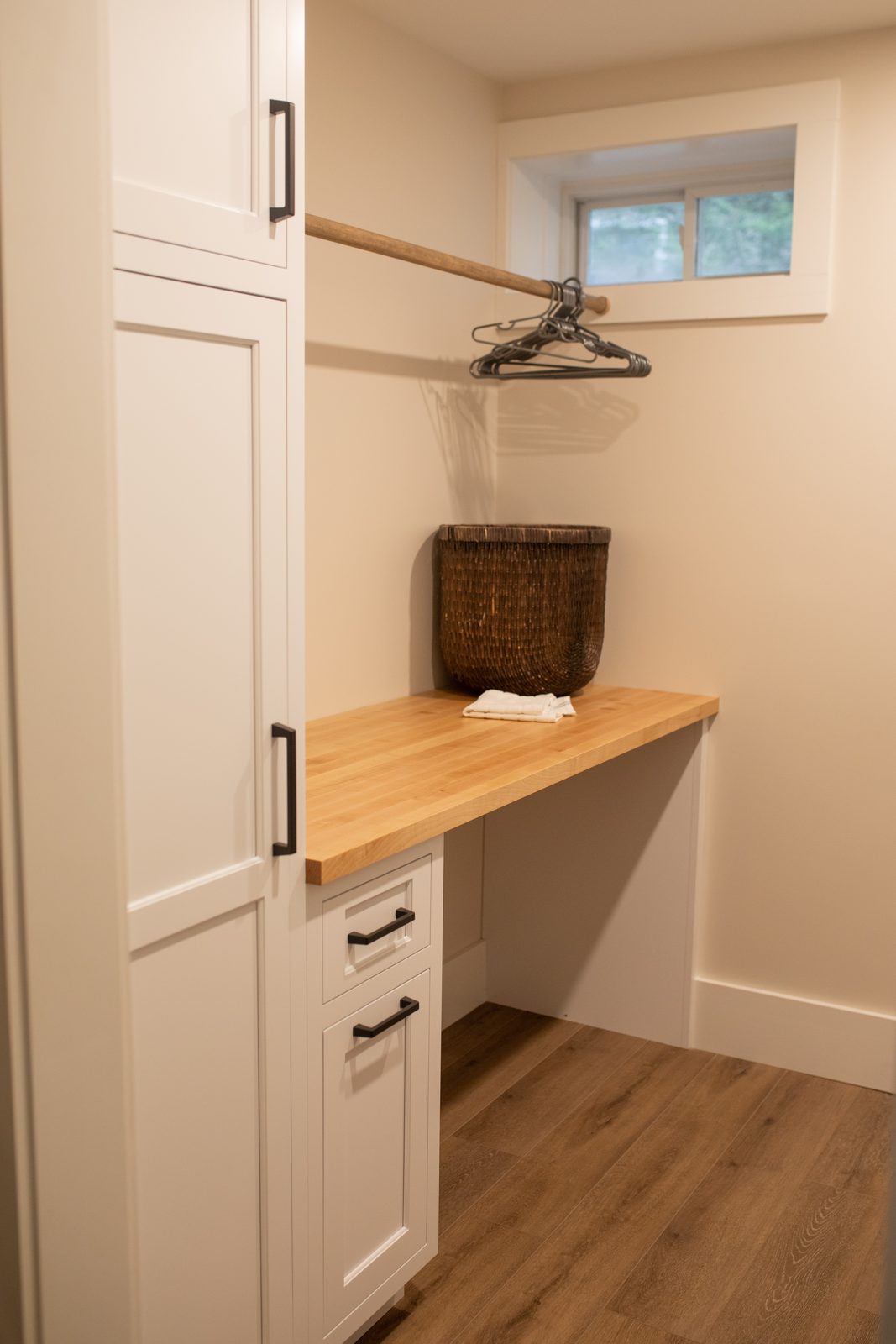 Fitted walk-in closet with butcher-block counter
