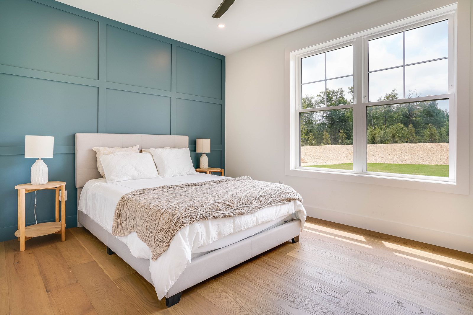 Bedroom with paneled accent wall