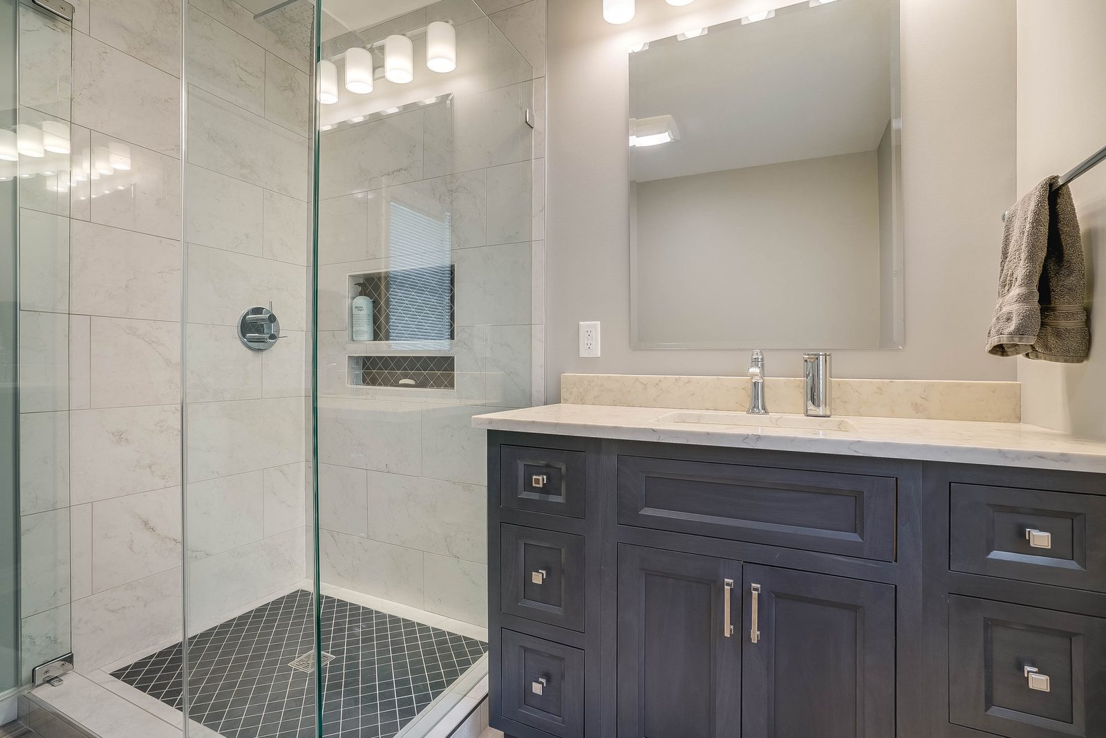 Glass shower and vanity in the second bath