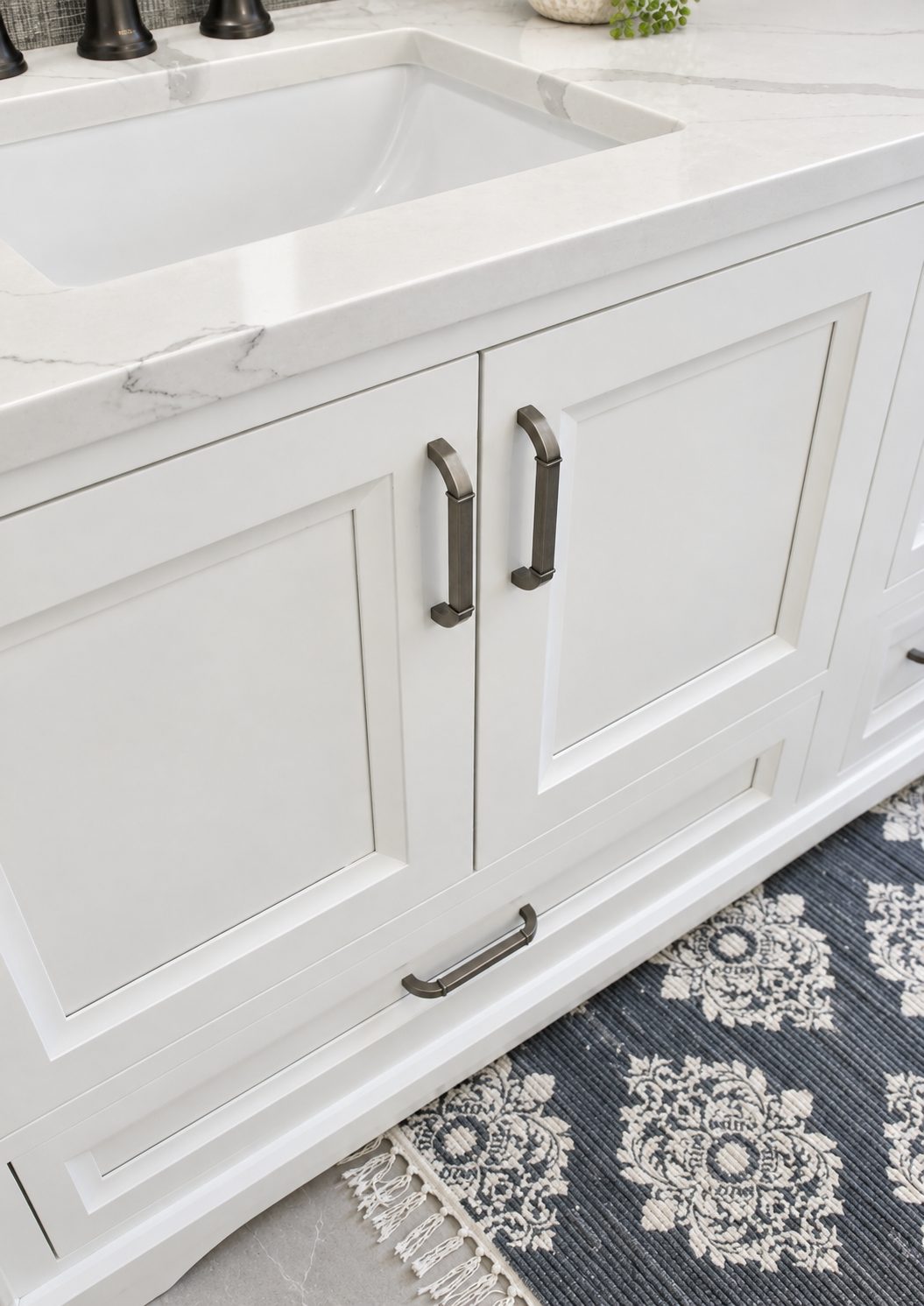 White flush-inset vanity with marble top