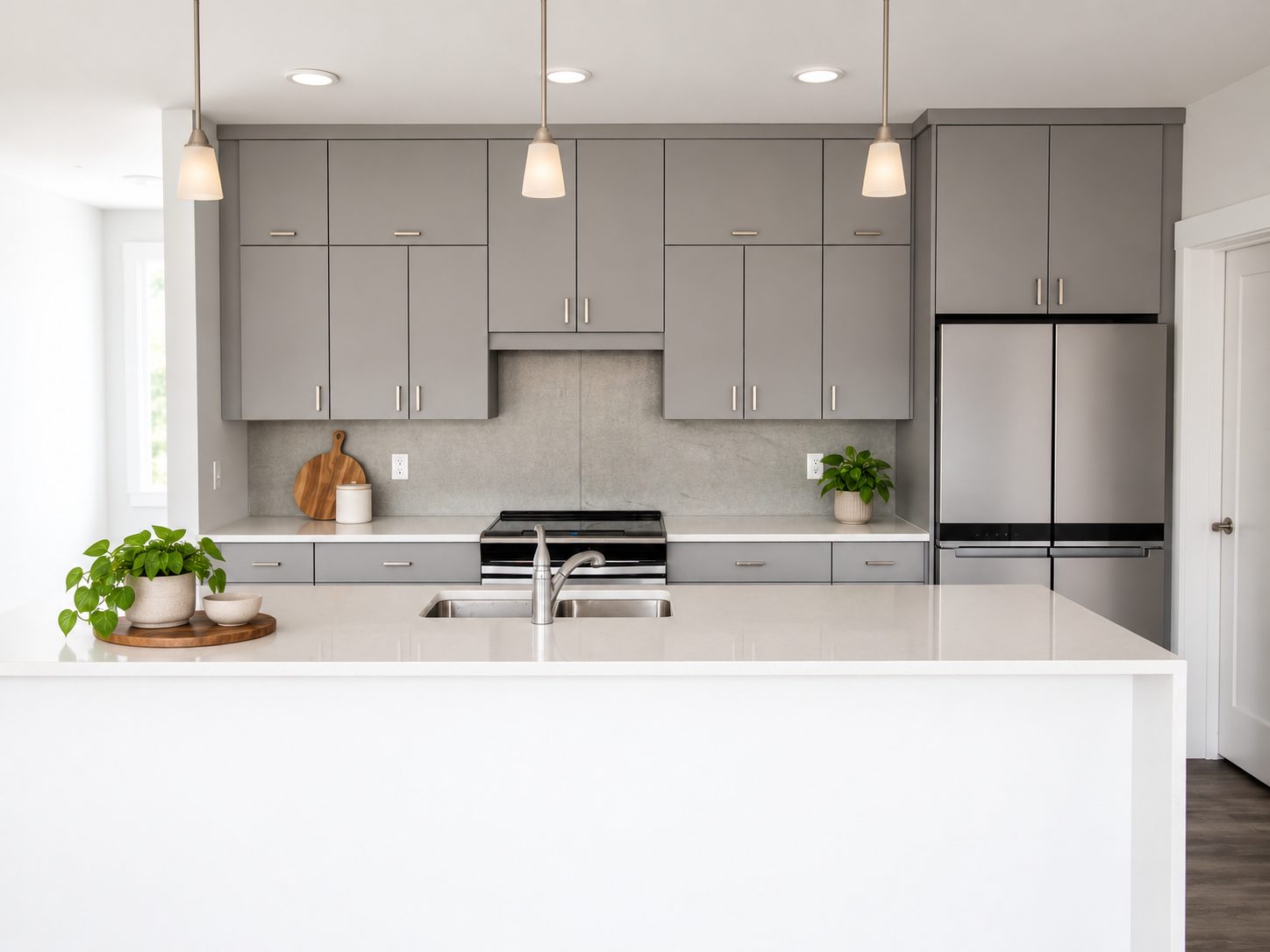 Waterfall quartz island in a finished Triumph kitchen