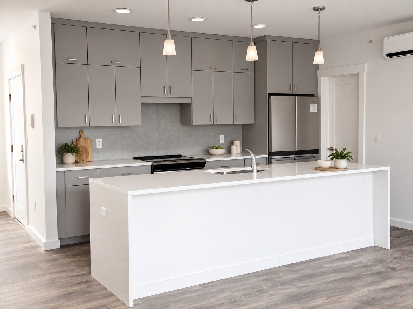 Finished multifamily unit interior with quartz island, Peterborough NH