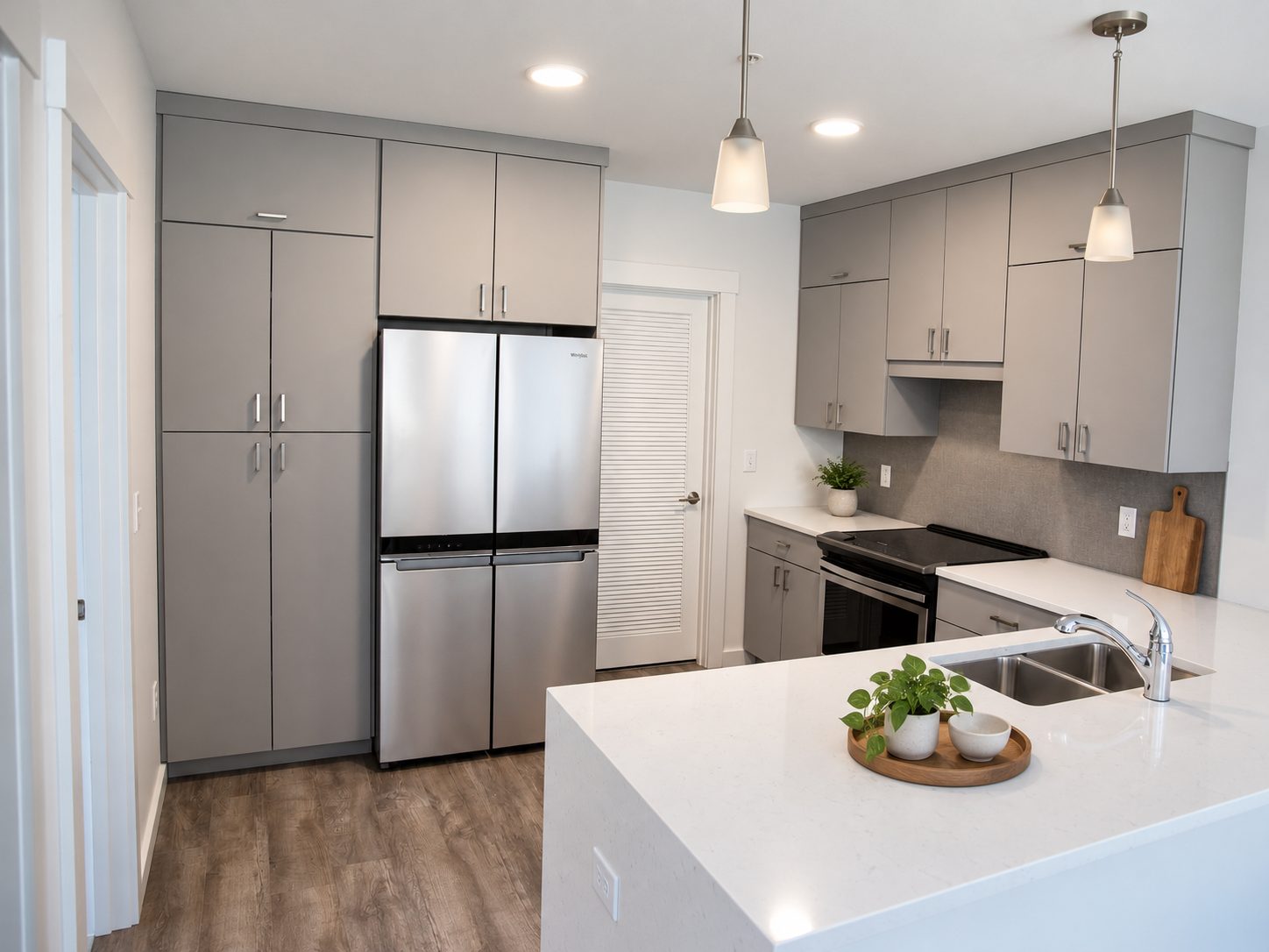 Waterfall island corner beside the pantry and fridge wall