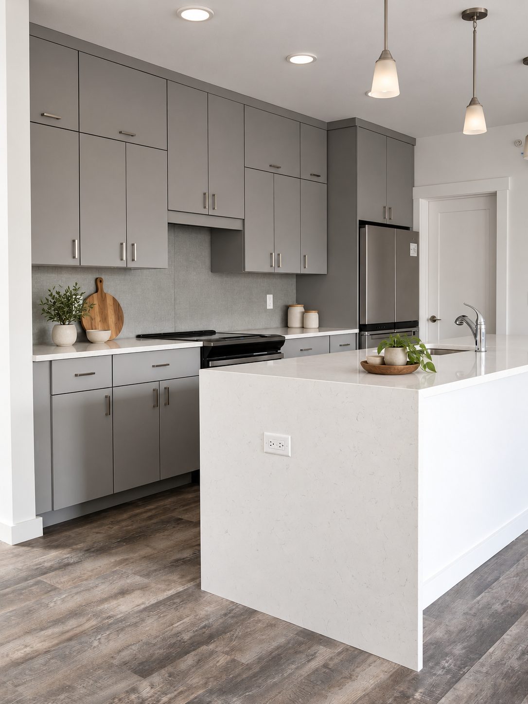 Gray flat-panel kitchen corner with island and pendants