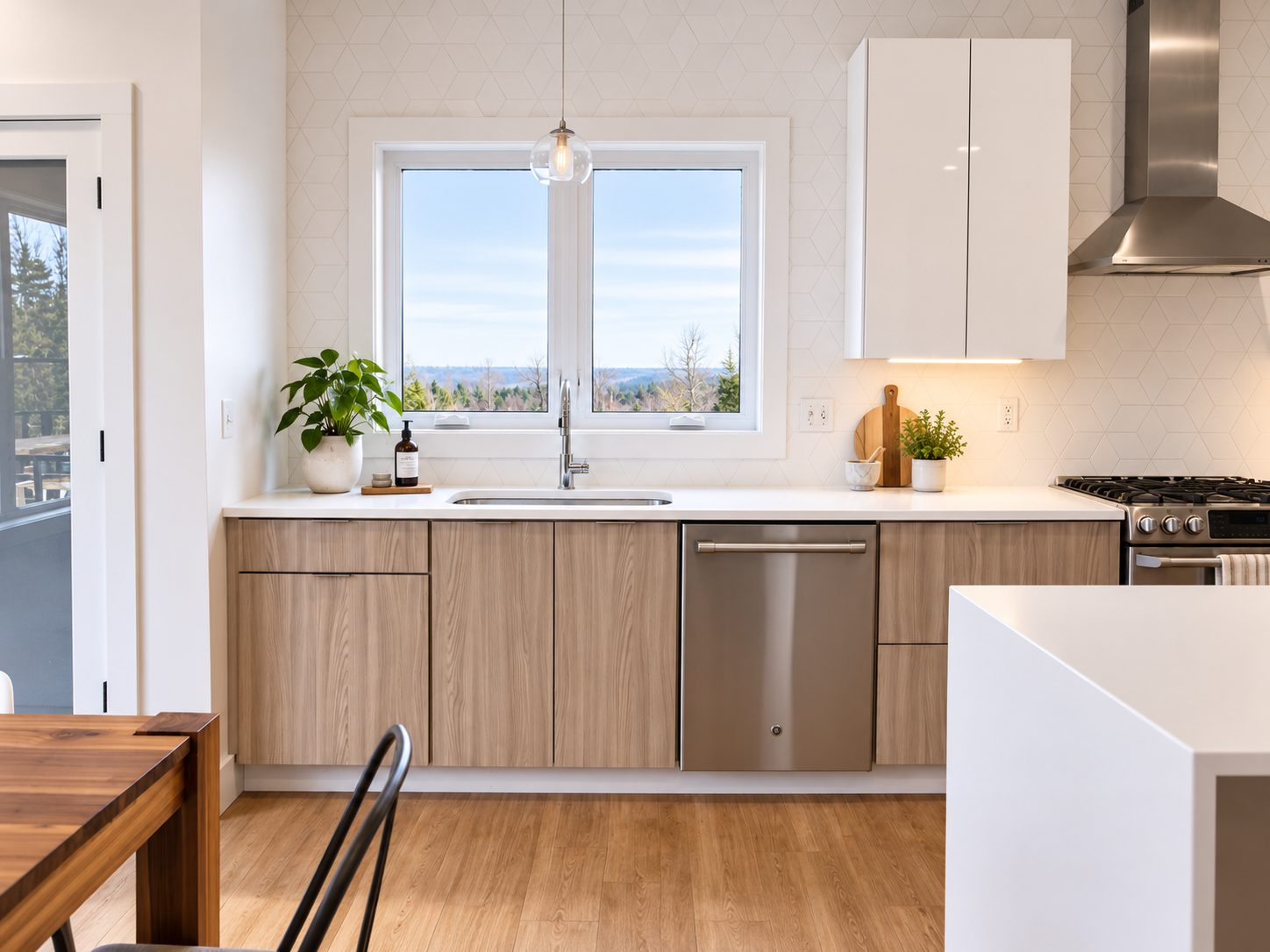 Sink wall with white uppers, light woodgrain flat-panel lowers and walnut table